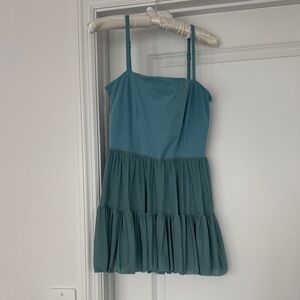 Teal Blogilates Dress with shorts.